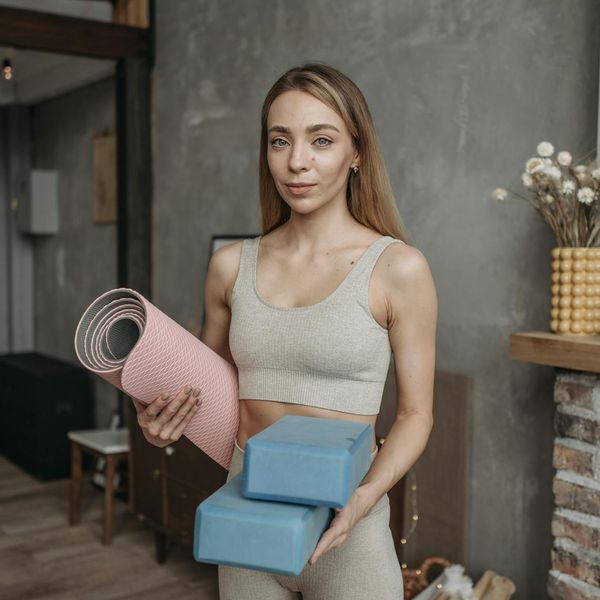 Woman holding a challenging yoga pose that demonstrates both strength and flexibility.